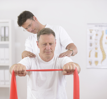 Physiotherapy: Senior man and physiotherapist